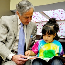 George Kaiser - Reading book to child